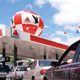 A photo of a Citgo where dozens of cars are lined up at the pump.